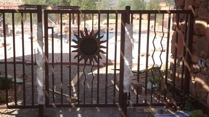 Ornamental steel gate with sun design at Gateway Canyons Resort